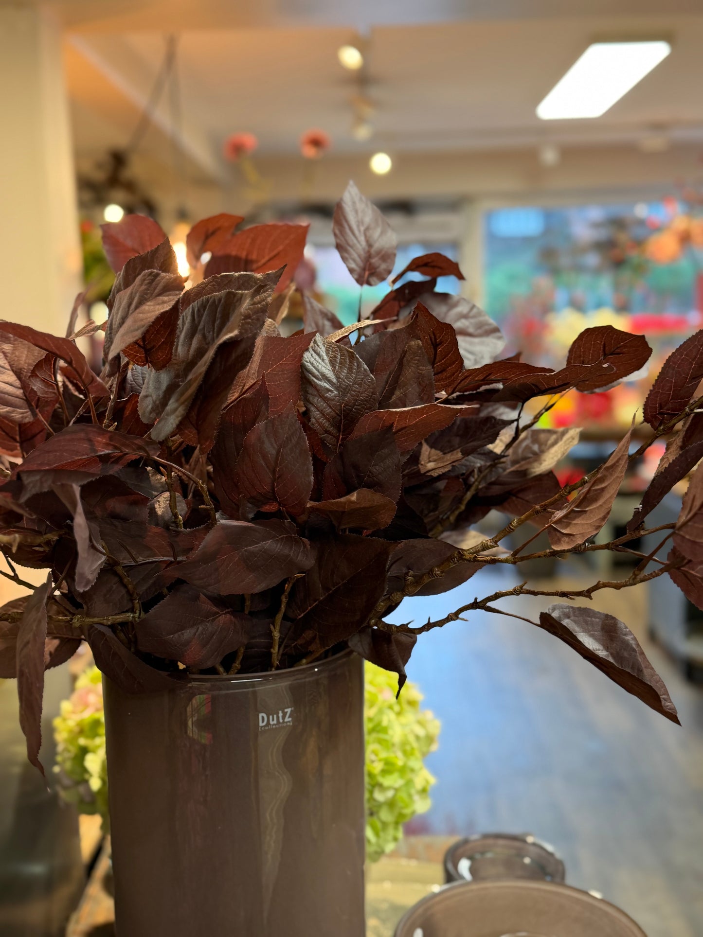 Seidenblume/Kunstblume Zweig Blatt Pflaume
